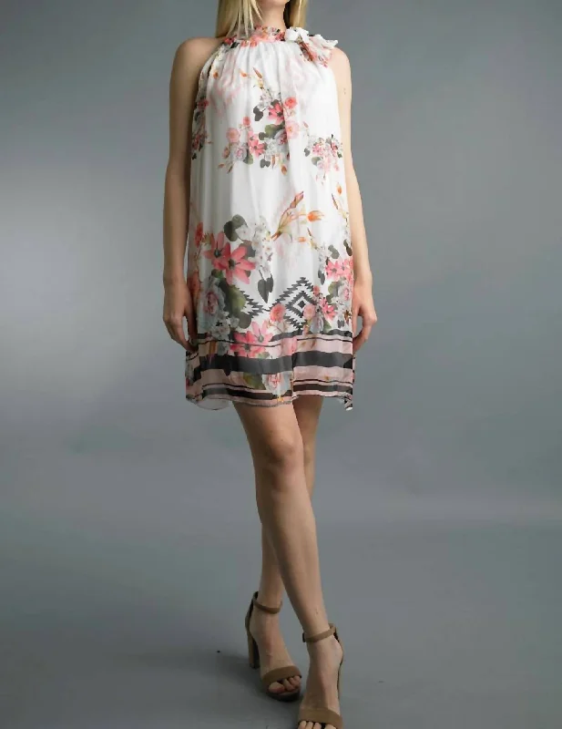 Iconic women’s outfits that never go out of style   Floral Print Silk Dress With Neck Tie In White Multi