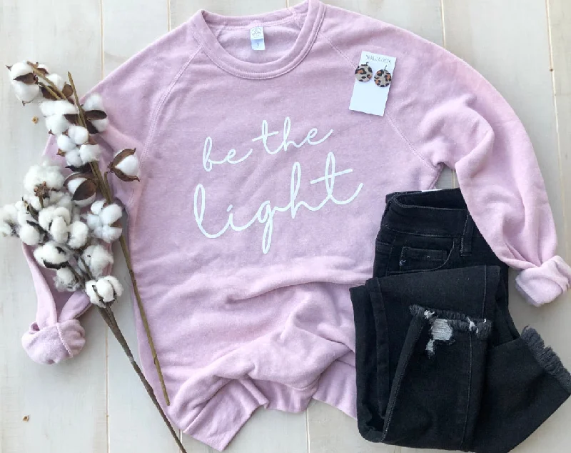 Elevate your style with fashionable women’s clothing   Be the Light sweatshirt