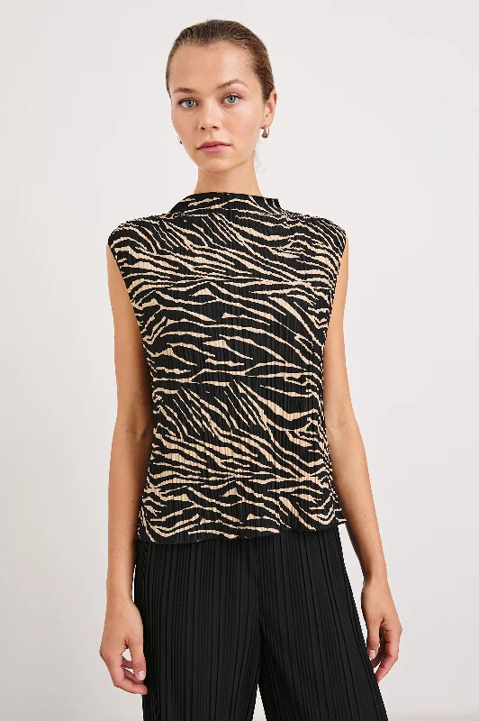 Step into style with our women’s clothing collection   TREA TOP - CAIRO