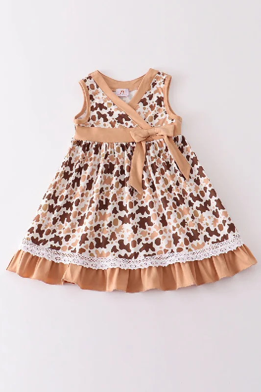 Comfortable yet stylish outfits for women on the go   Brown cow print girl dress