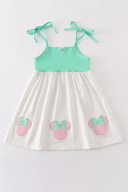 Dress to impress with elegant women’s wear   Green character applique strap dress