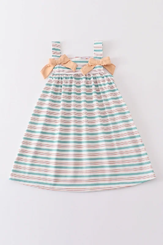 Feminine silhouettes for the modern woman   Green stripe bow dress